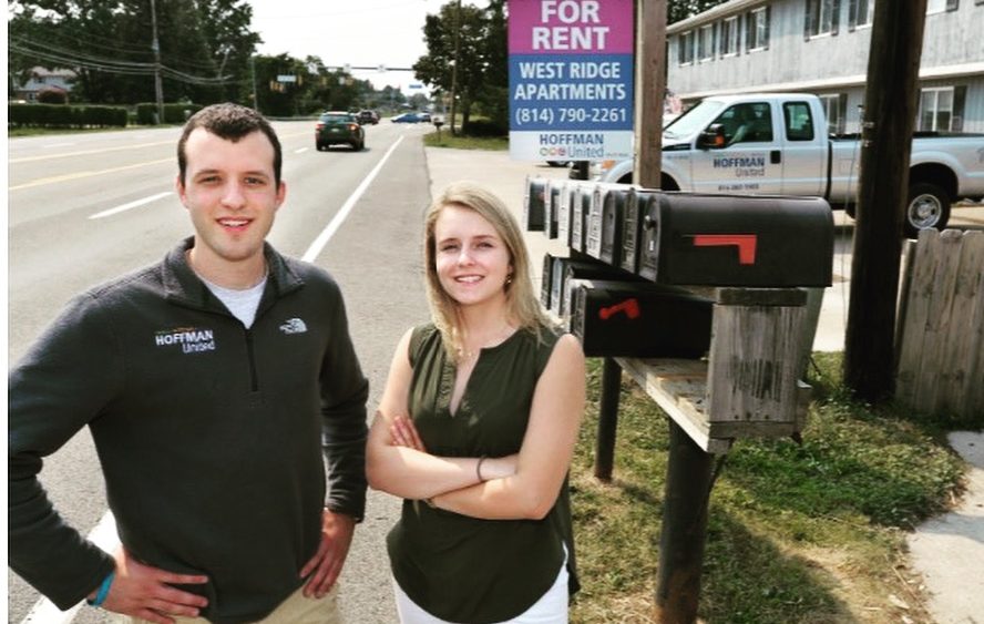 Paul and Christine Hoffman standing in front of West Ridge Apartments